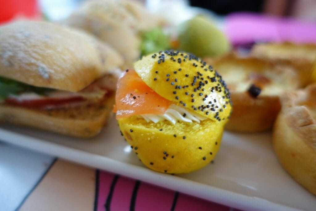 Close up of the yellow mini smoked salmon bagel