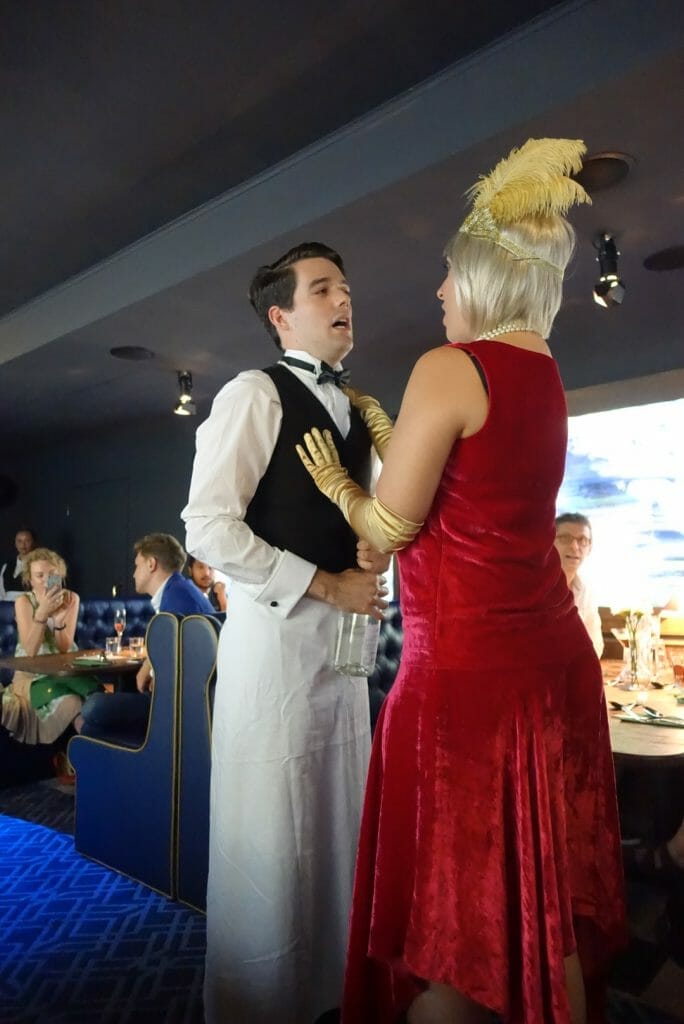 The waiter and Miss Tilly up close