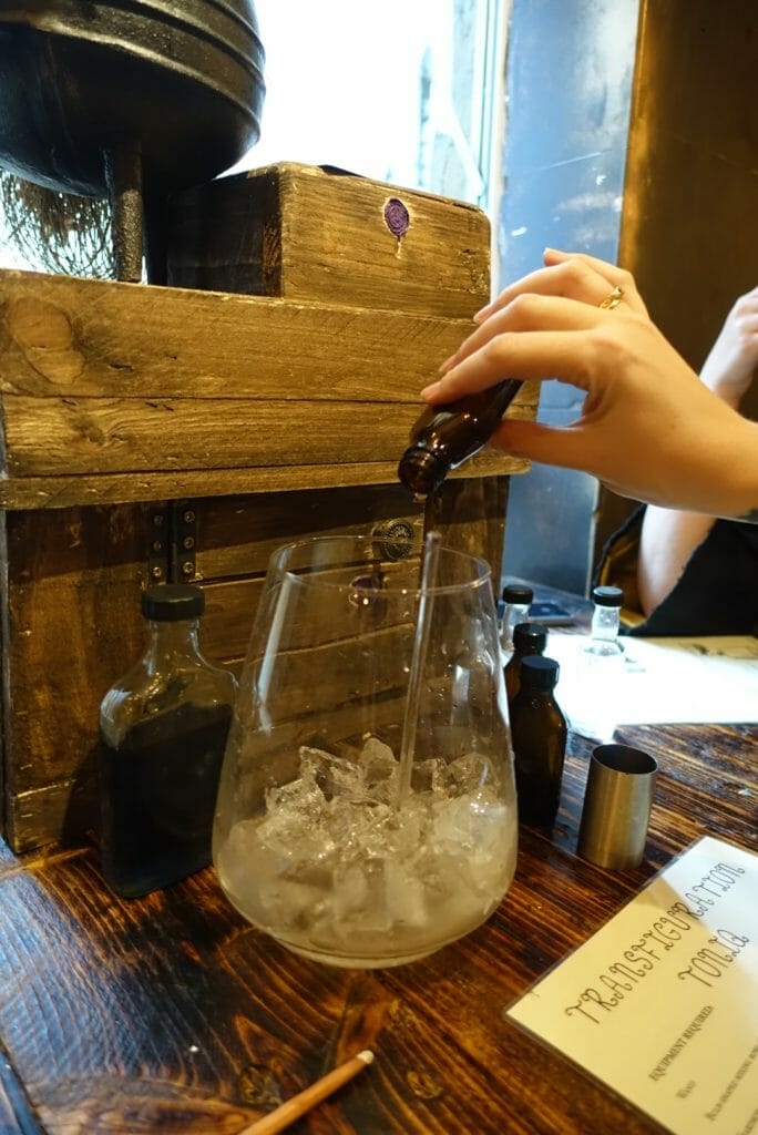 Pouring liquid into the glass flask