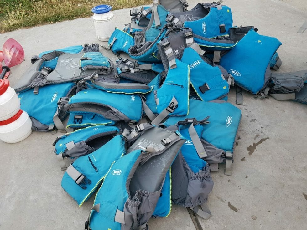 The pile of life jackets at the end of the kayak