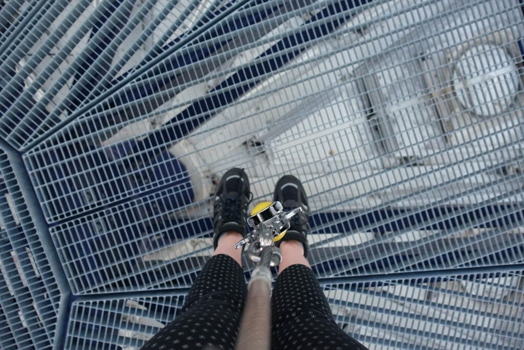 Shot looking down at Katie's feet with the carabineer dangling