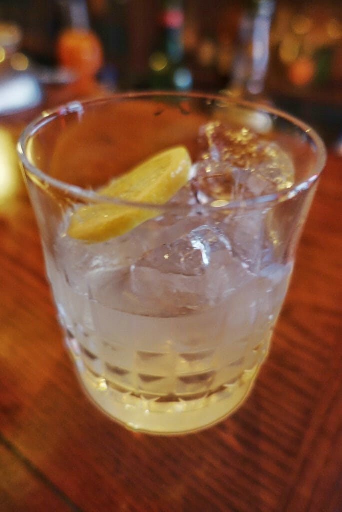 Glass of Limer's punch with ice and lemon slice