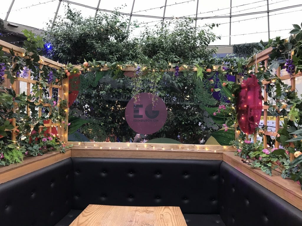 The Edinburgh Gin bar covered in flowers at the student union