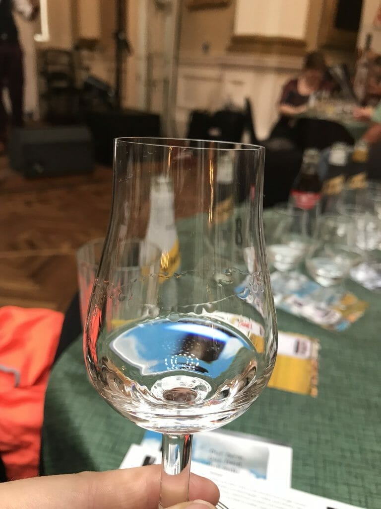 Glass of clear spirit showing 'legs' which are the drops in the inside of the glass after swirling it. 