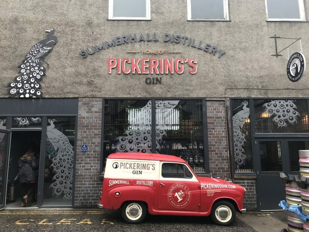 The outside of Pickering's distillery at Summerhall with red Pickering's van parked out front