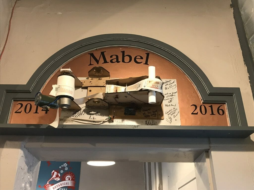 Mabel - the old labelling machine that is now retired and has pride of place on the wall at the distillery