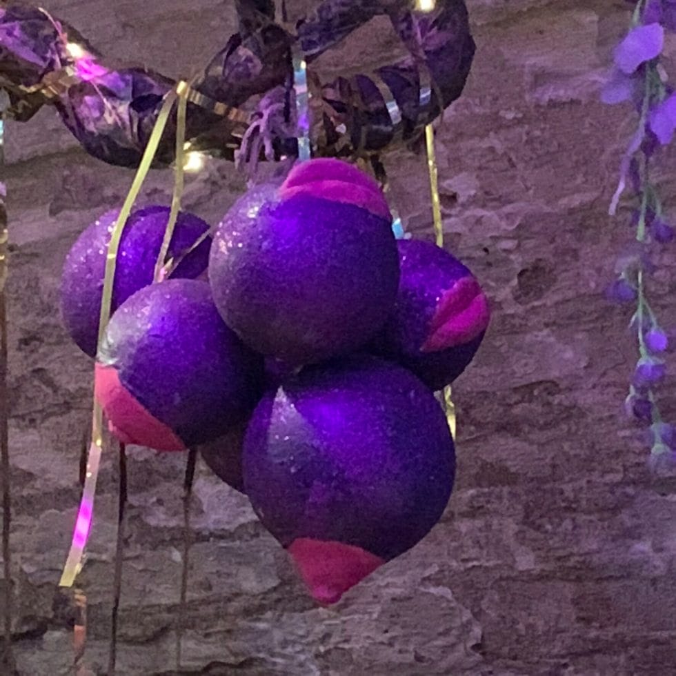 Purple baubles with lips and nipples attached