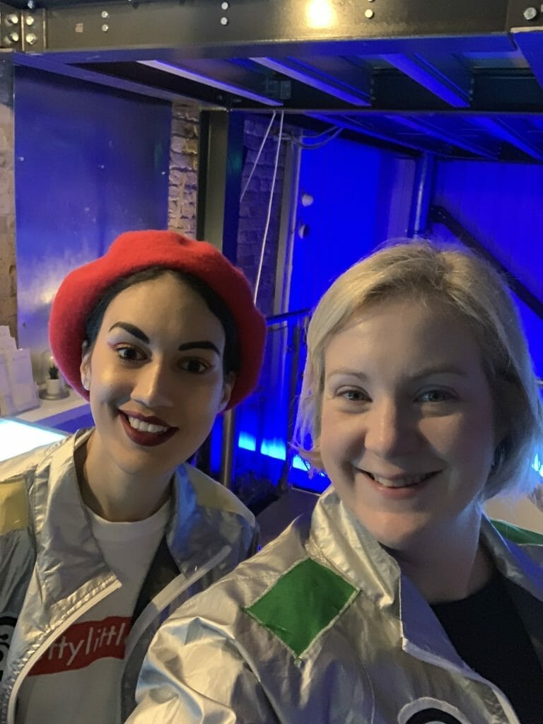 Ana in red beret and silver jacket with Katie 