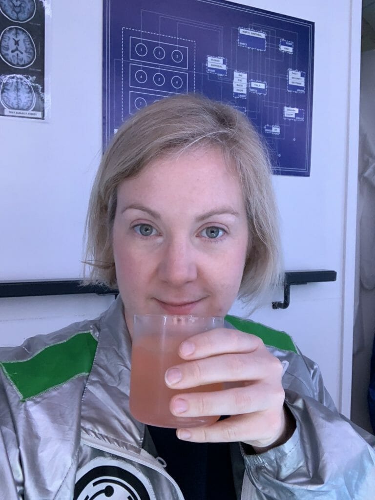 Katie drinking the nanobot cocktail