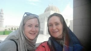 Katie and friend wearing headscarves outside the Grand Mosque