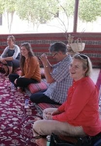 Katie and the others sitting traditionally with shoes off