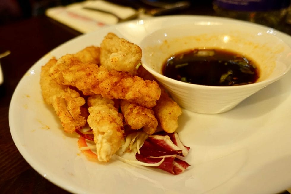 Scored deep fried squid with dipping sauce