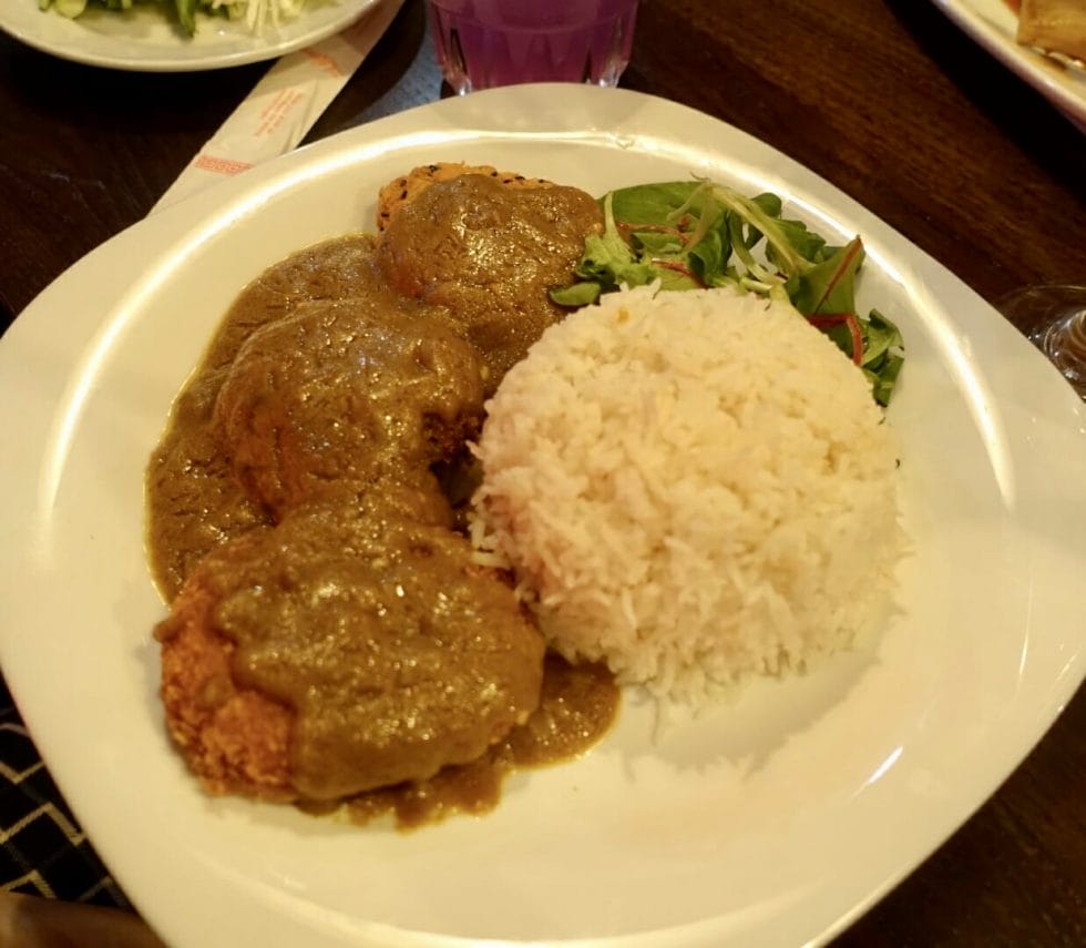 Yasai Katsu Curry - deep fried breaded vegetables with curry sauce, rice and salad garnish