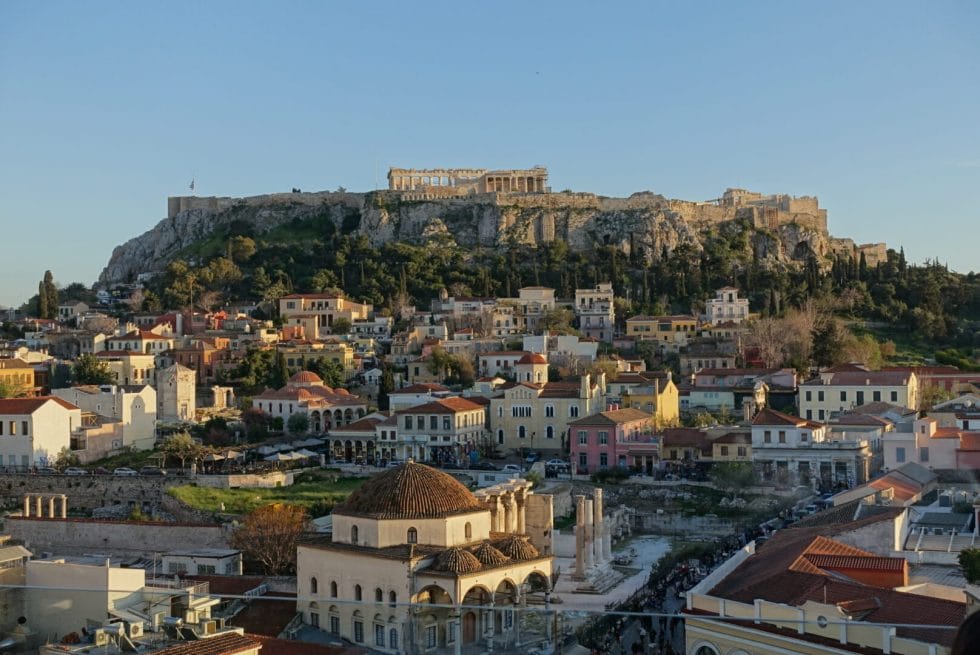 View of the Acropolis from a rooftop bar at sunset