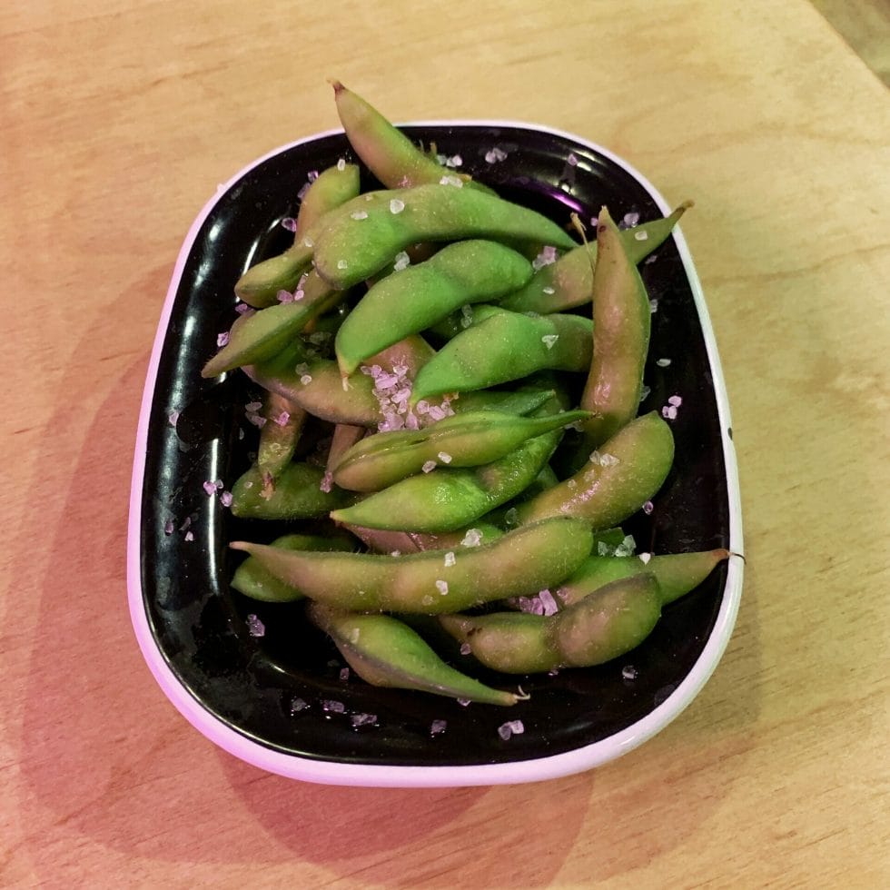 Bowl of salted edamame beans