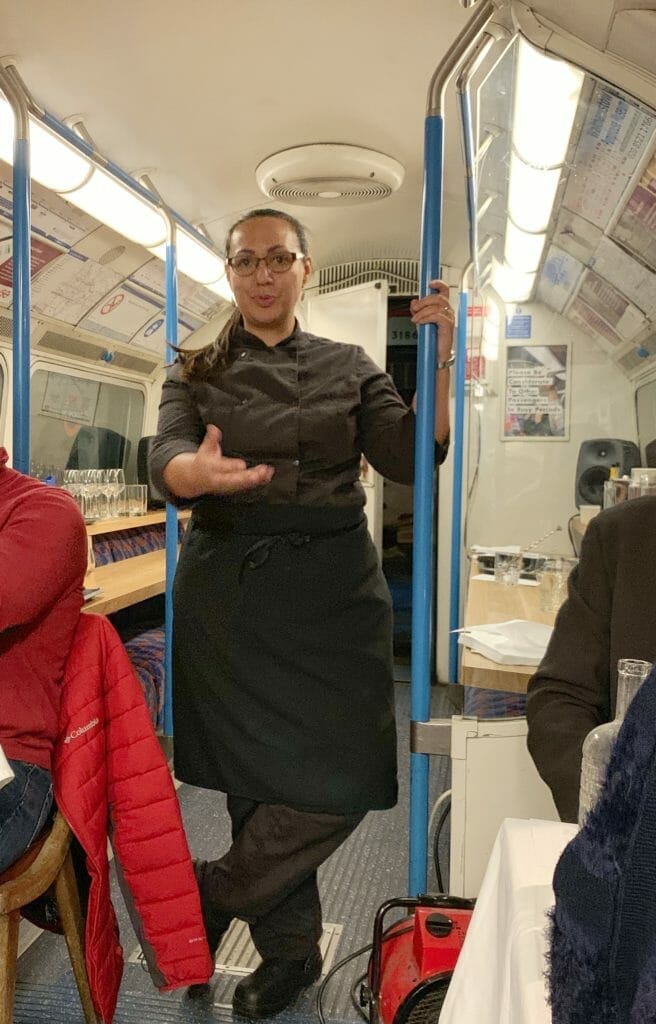 Chef Bea introducing the menu in the tube train