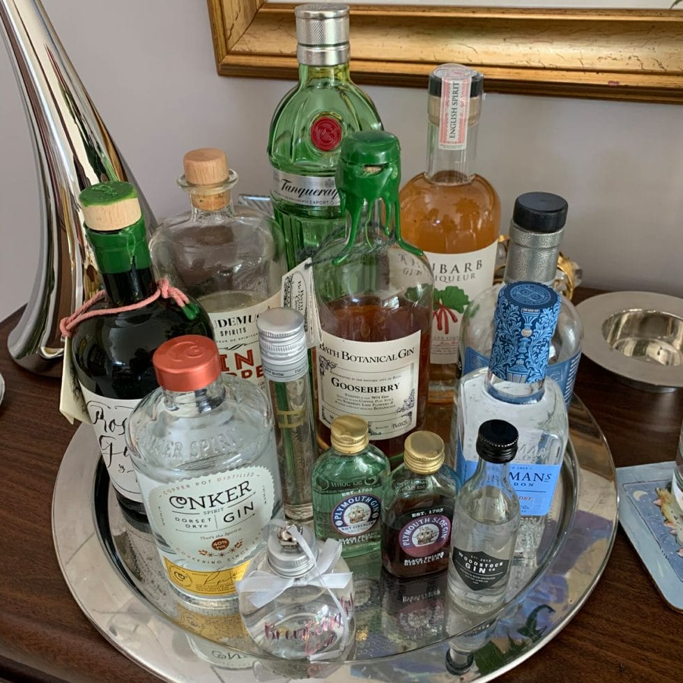 A tray of gin bottles large and small