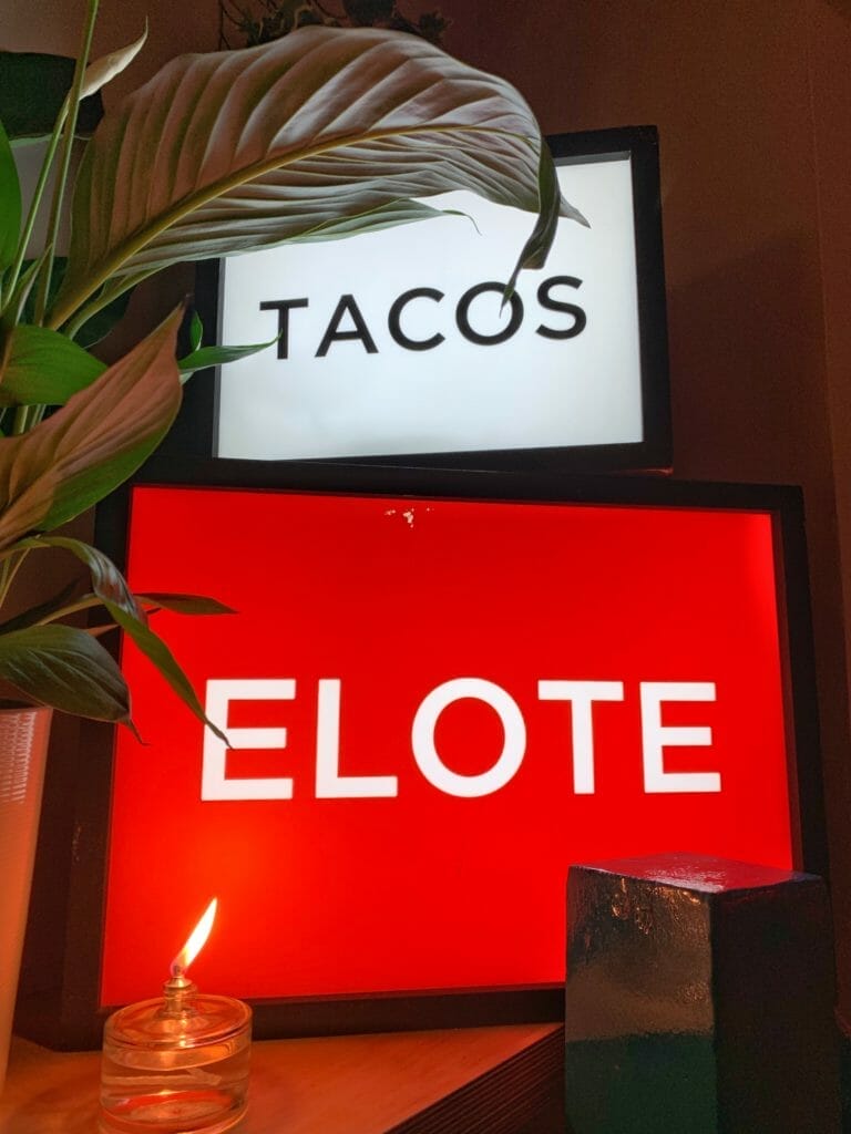 Lightboxes spelling out TACOS and ELOTE