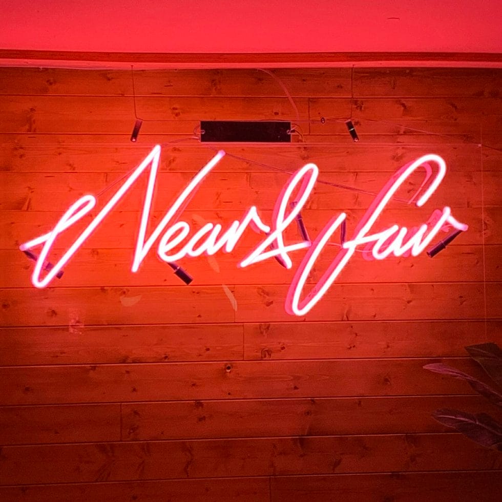 Red neon sign of Near and Far 