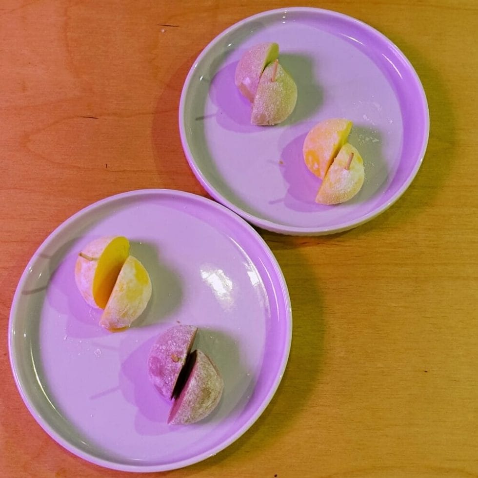 Flat-lay, two plates of ice cream mochi