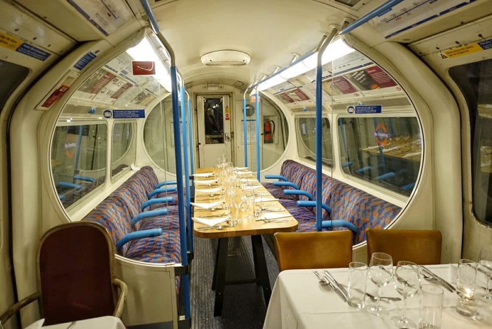 The inside of the Supperclub.tube carriage with tables set for dinner