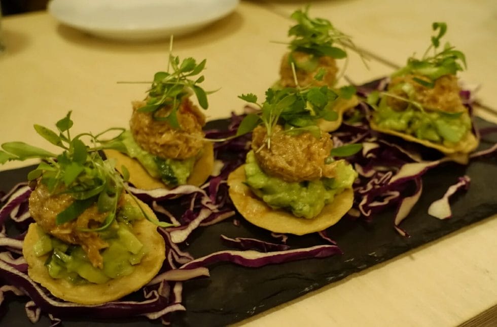 Little toastadas (small round tortillas) loaded with crab and avocado