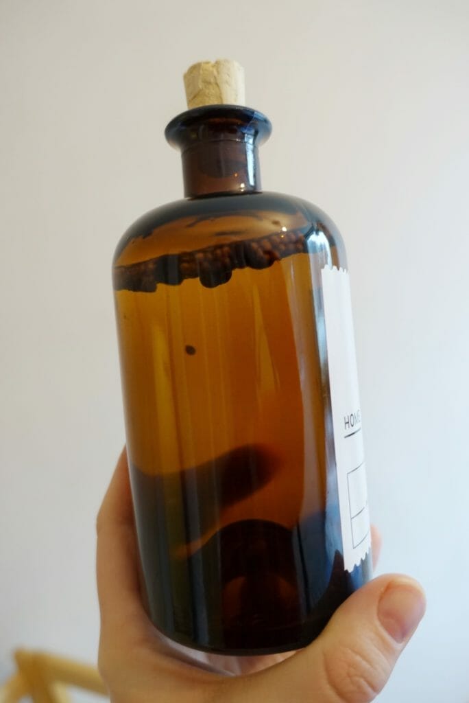 Close up of the botanicals in the bottle with the vodka