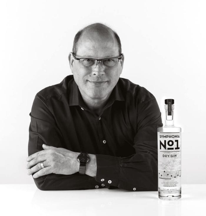 Distiller Ric with a bottle of his Symphonia No. 1 gin