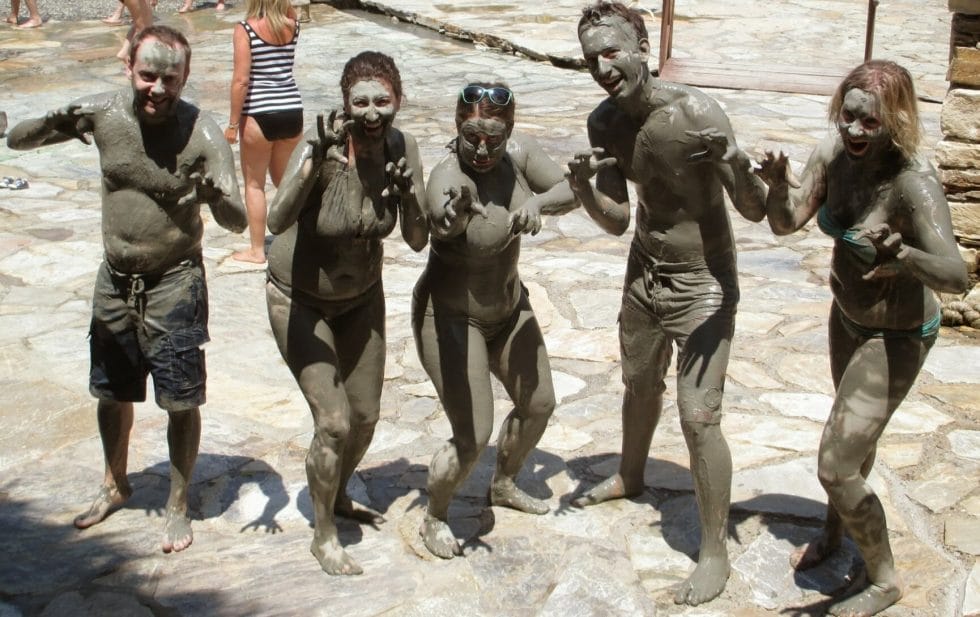 Katie and friends covered in mud in Turkey on a G Adventures tour
