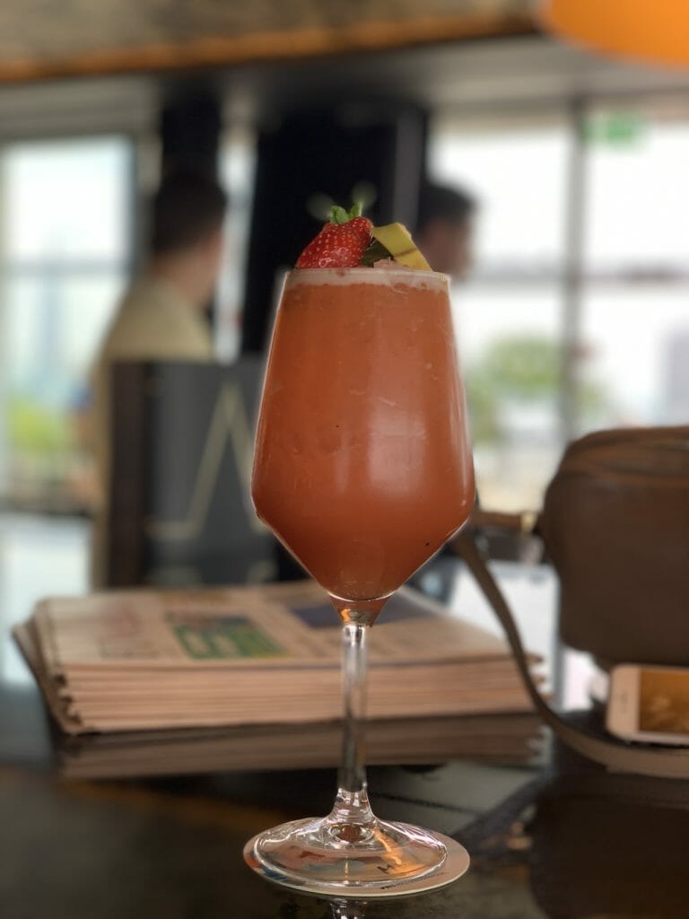 Tropical punch cocktail with fruit on top