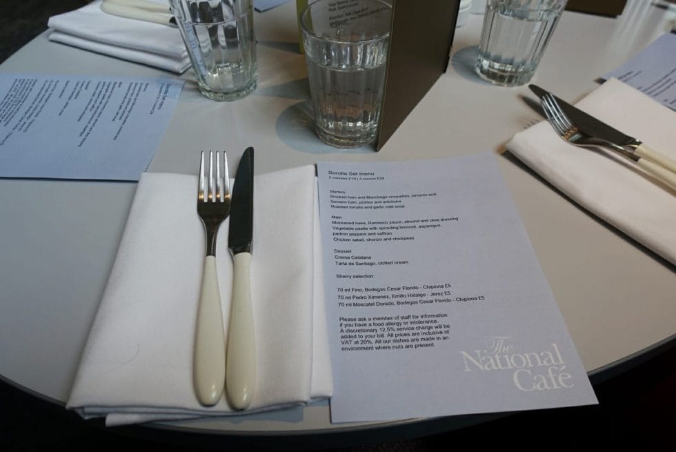 Menu on the table with knife and fork
