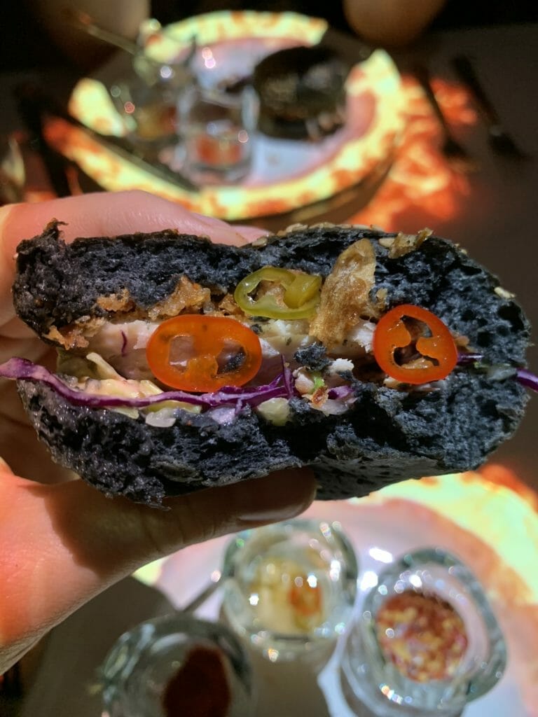 Close up of inside of bun with extra chilli pickles