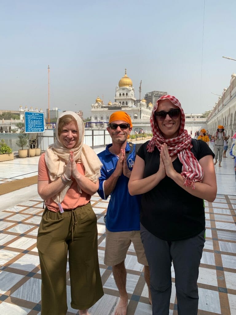 The group with scarfs or bandannas to cover their heads at the Sikh temple in Delhi