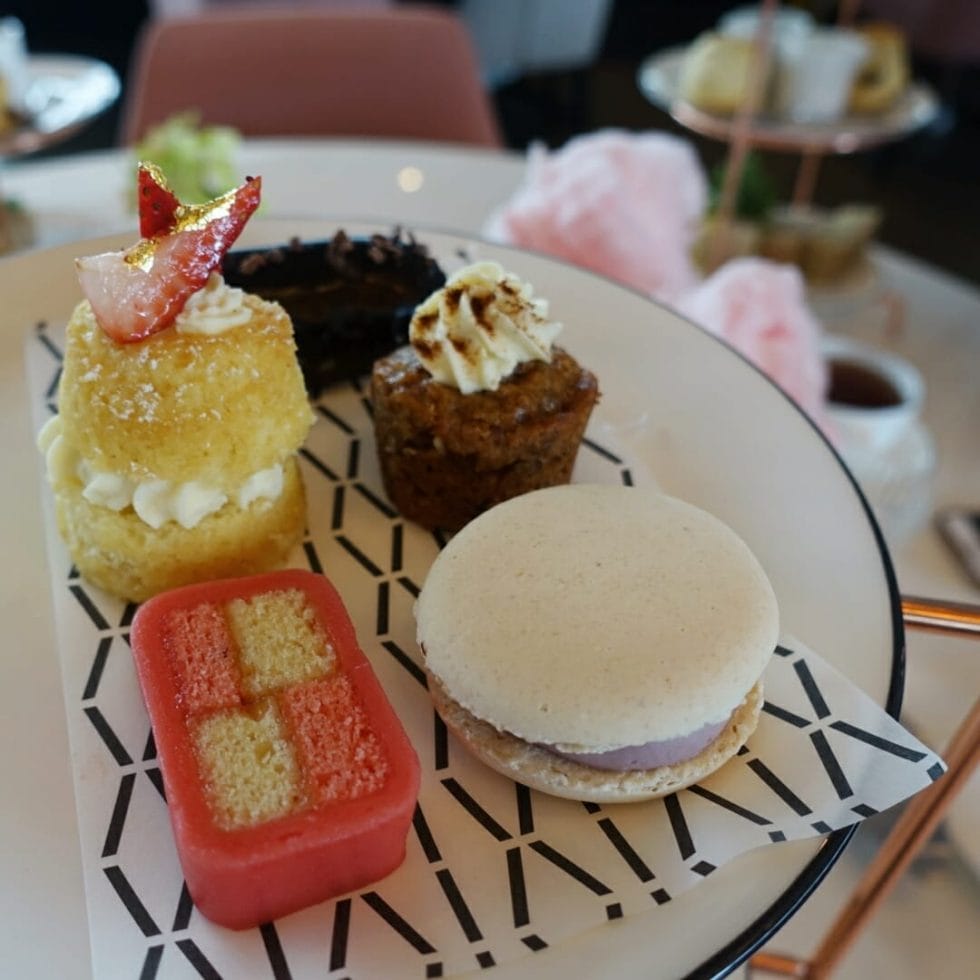 Plate of tiny cakes and other sweet treats