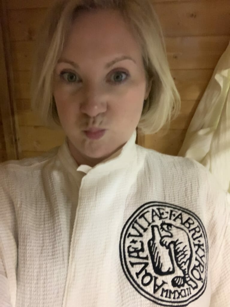 Katie in robe inside the sauna