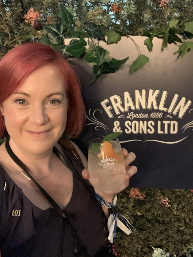 Katie with G&T by the Franklin & Sons Ltd sign