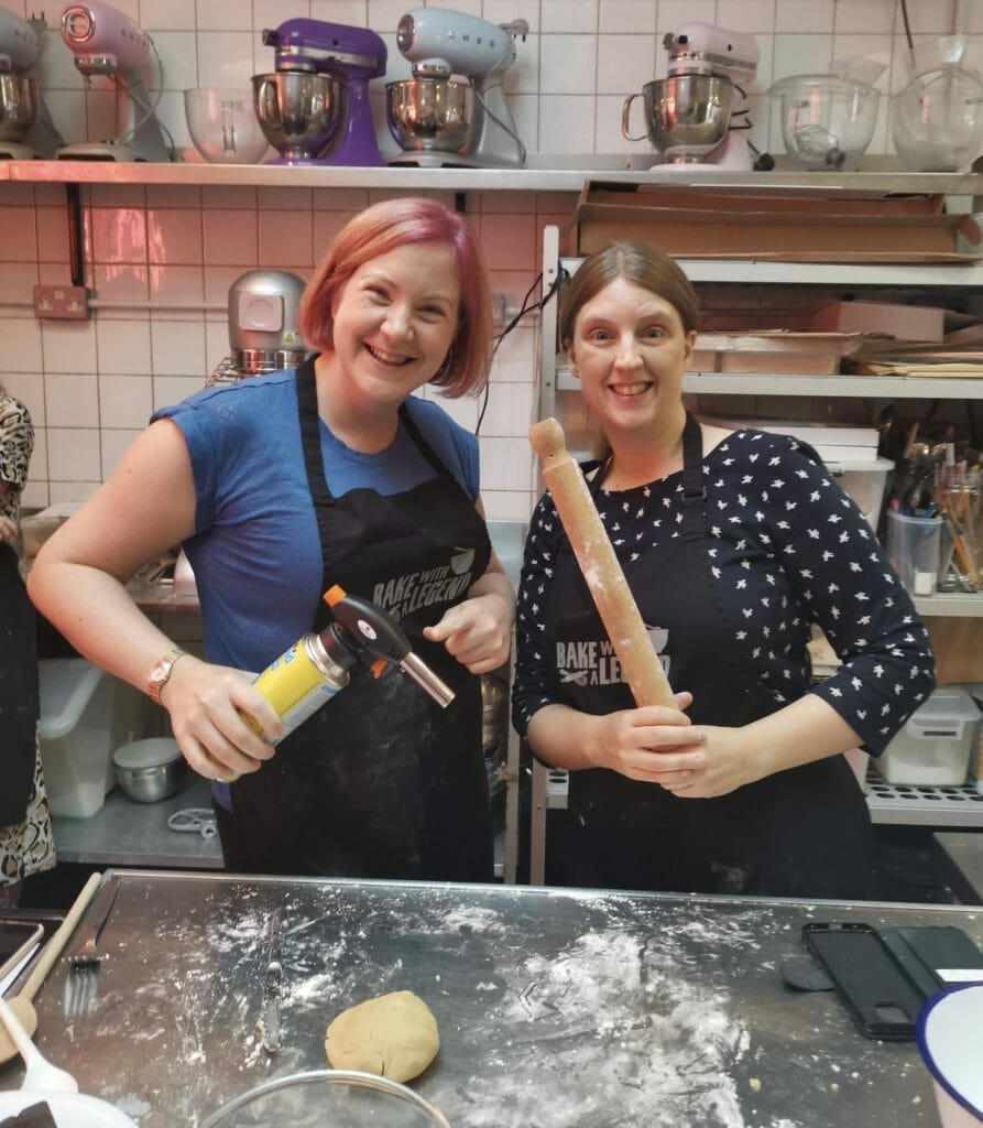 Katie and Jo with rolling pin and blow torch