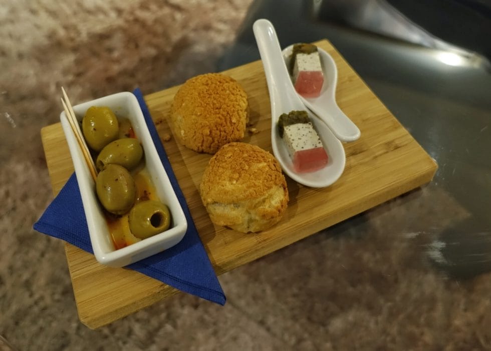 Pre dinner snacks served on a wooden board