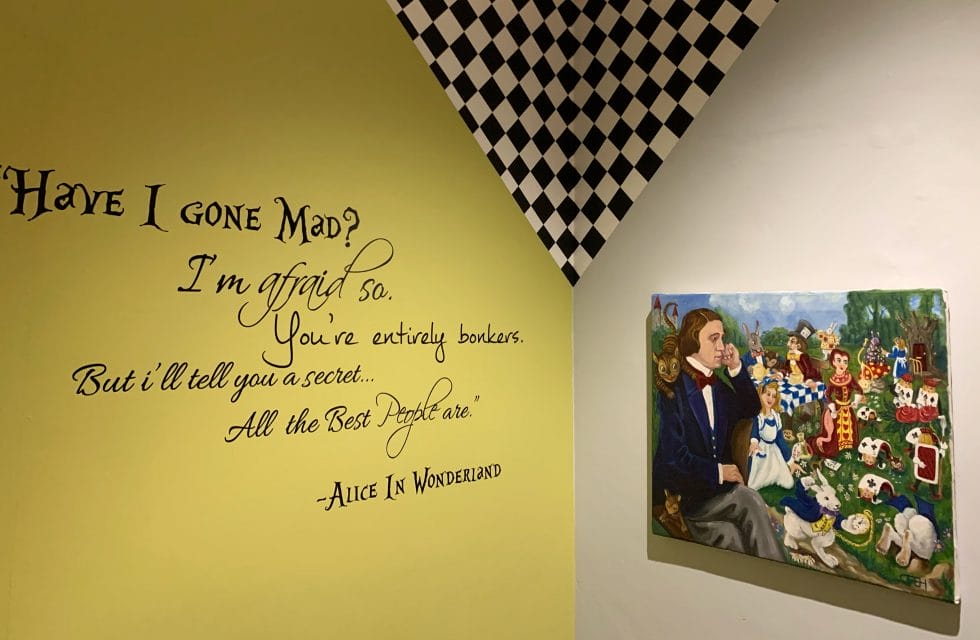 Quote from Alice in Wonderland on the wall