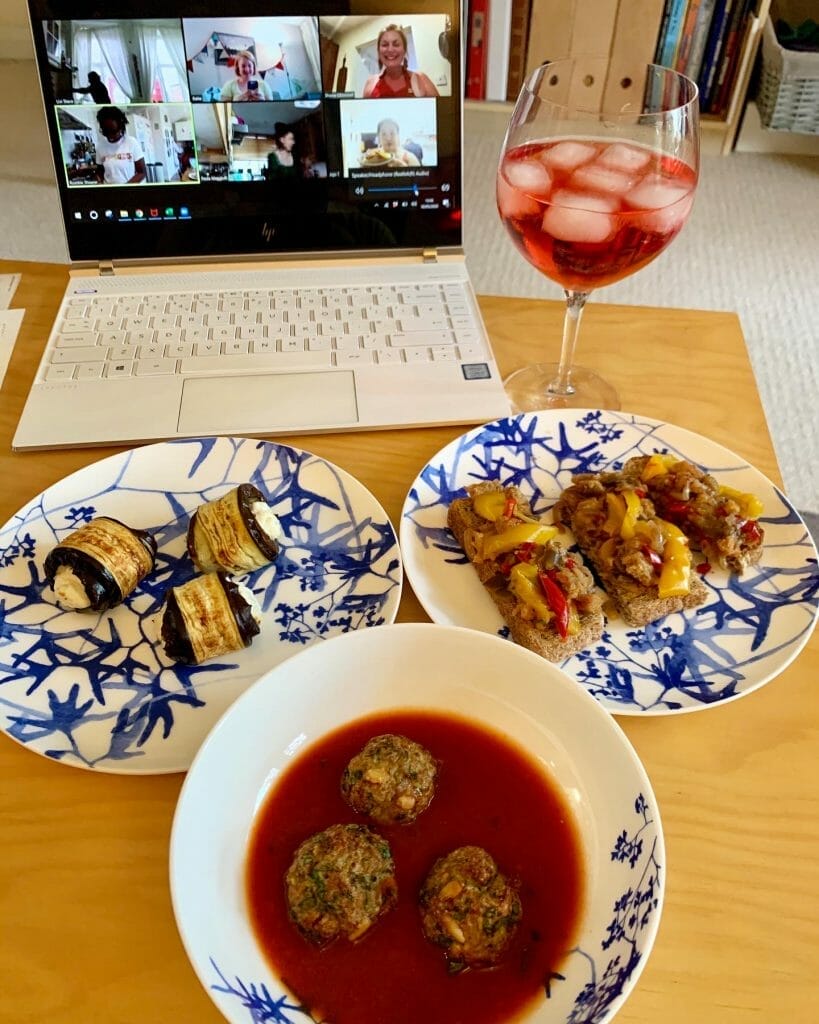 Aperitivo dishes in front of the laptop