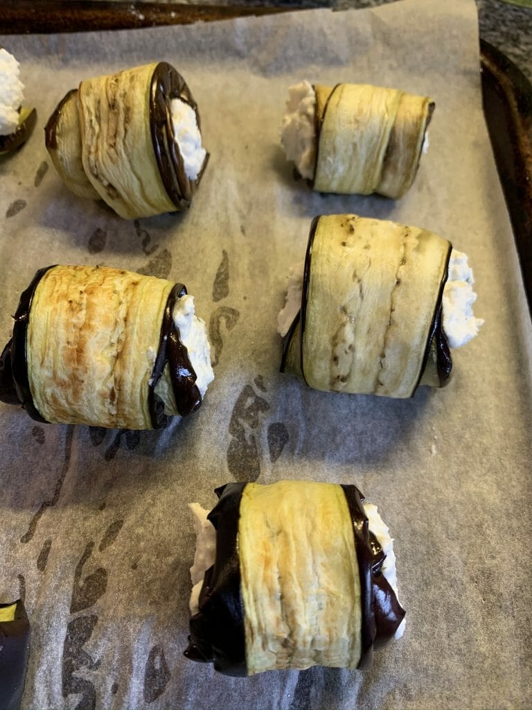 Aubergine rolls with the ricotta filling ready to go into the oven