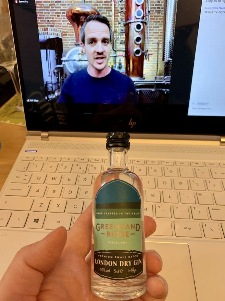 Will Edge from Greensands Ridge in front of his still on screen and mini tasting bottle of the gin in front