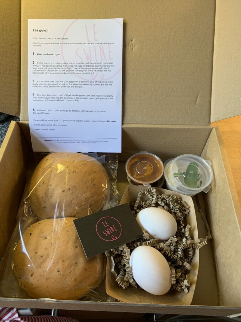 Box with eggs, buns and garnishes showing