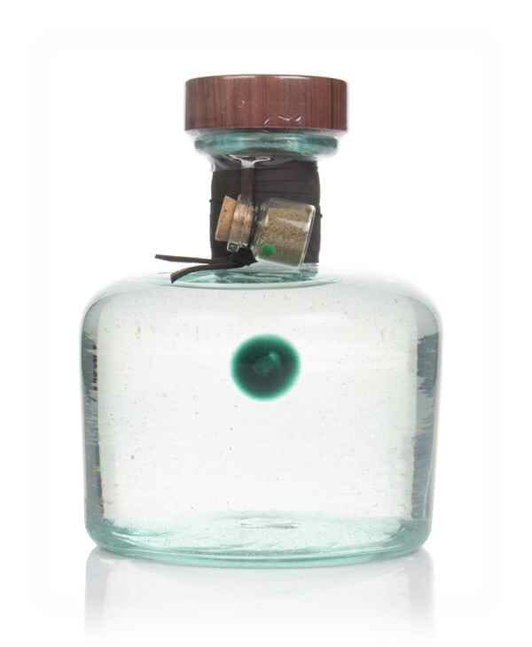 Hand blown glass bottle with green dot in the glass and mini bottle of salt attached to the leather wrapping around the neck